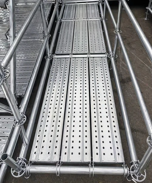 Installed scaffolding steel plank used as walkway on site