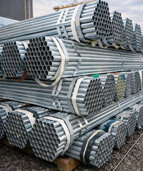 Galvanized scaffolding tubes stacked for construction use